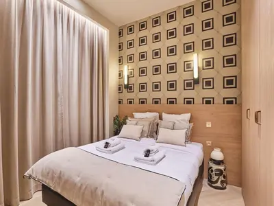 Un ou plusieurs lits dans un hébergement de l'établissement Apartment Suite Saint Germain Rue de Rennes