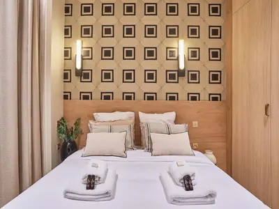 Un ou plusieurs lits dans un hébergement de l'établissement Apartment Suite Saint Germain Rue de Rennes