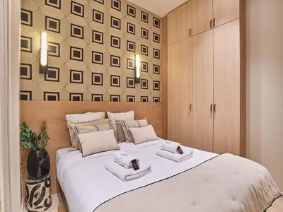 Un ou plusieurs lits dans un hébergement de l'établissement Apartment Suite Saint Germain Rue de Rennes