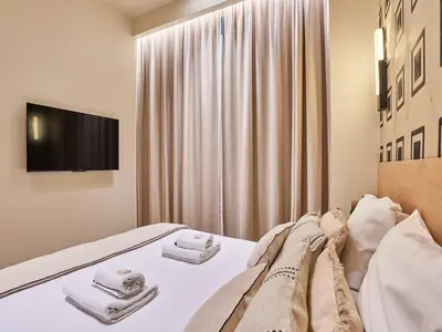 Un ou plusieurs lits dans un hébergement de l'établissement Apartment Suite Saint Germain Rue de Rennes