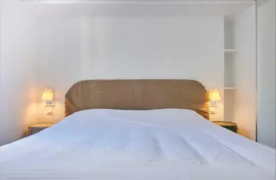 Un ou plusieurs lits dans un hébergement de l'établissement Modern Apartement 1BR 2P - Abbesses