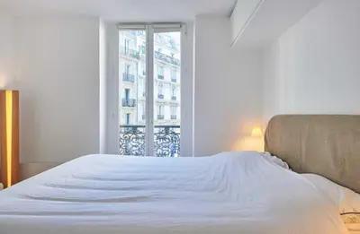 Un ou plusieurs lits dans un hébergement de l'établissement Modern Apartement 1BR 2P - Abbesses