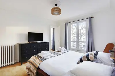 Un ou plusieurs lits dans un hébergement de l'établissement Beautiful apartment - 2BR 4P - Arc de Triomphe