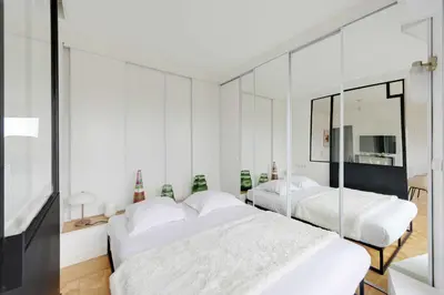 Un ou plusieurs lits dans un hébergement de l'établissement A C 2P apartment with terrace and view of Paris