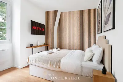 Un ou plusieurs lits dans un hébergement de l'établissement Studio Elegant Redecore - Confort et Calme a Paris