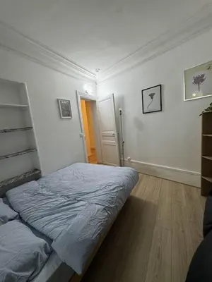 Un ou plusieurs lits dans un hébergement de l'établissement Logement entier appartement Paris, France