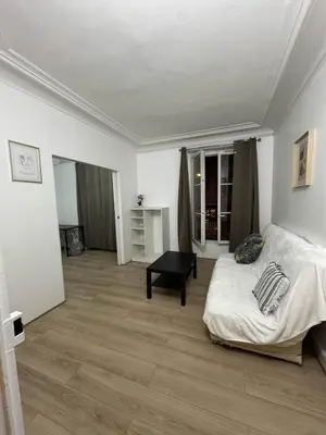 Un ou plusieurs lits dans un hébergement de l'établissement Logement entier appartement Paris, France