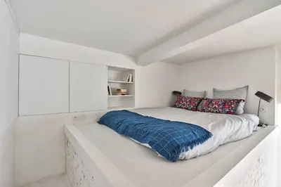 Un ou plusieurs lits dans un hébergement de l'établissement Spacious Apartment 1BR 2P – Auteuil