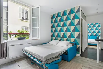 Un ou plusieurs lits dans un hébergement de l'établissement Charming apartment design near Sorbonne