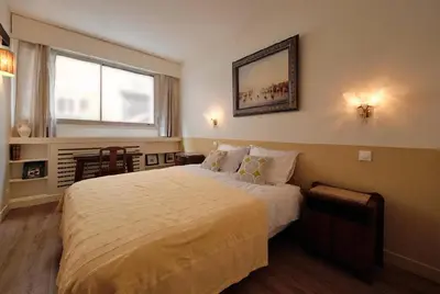 Un ou plusieurs lits dans un hébergement de l'établissement Chic & cosy 2BR - à deux pas Tour Eiffel 2BR