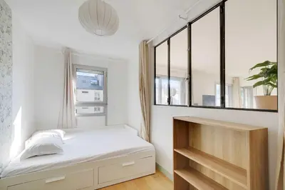 Un ou plusieurs lits dans un hébergement de l'établissement Spacious parisian apartment - 2BR 4P – République