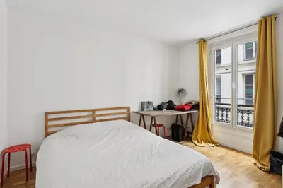 Un ou plusieurs lits dans un hébergement de l'établissement Charmant appartement pour 4 à Paris