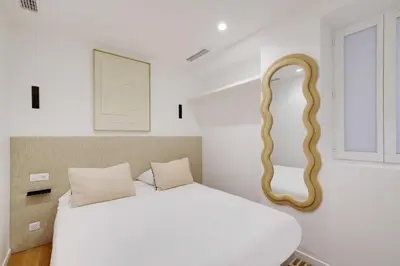 Un ou plusieurs lits dans un hébergement de l'établissement Modern apprt 1BR 4P - Paris 2nd