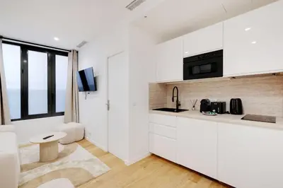 Télévision ou salle de divertissement dans l'établissement Modern apprt 1BR 4P - Paris 2nd