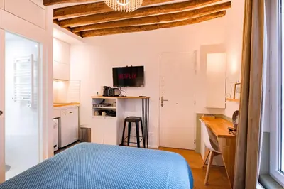 Un ou plusieurs lits dans un hébergement de l'établissement Charming Studio Montorgueil