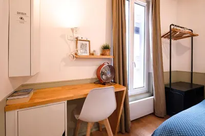 Un ou plusieurs lits dans un hébergement de l'établissement Charming Studio Montorgueil