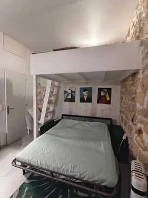 Un ou plusieurs lits dans un hébergement de l'établissement Studio calme pour 4 au cœur du Marais