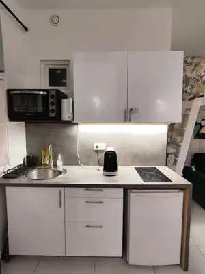 Cuisine ou kitchenette dans l'établissement Studio calme pour 4 au cœur du Marais
