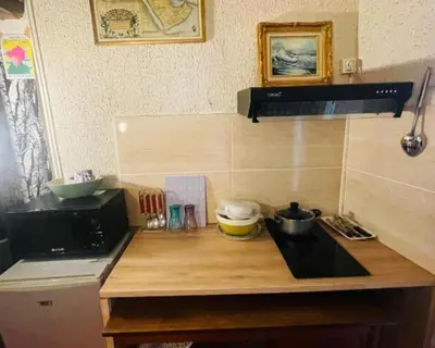 Cuisine ou kitchenette dans l'établissement Cozy Home near Notre-Dame