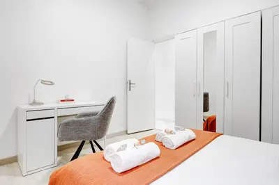 Un ou plusieurs lits dans un hébergement de l'établissement Suite Magenta - Opulence au cœur de Paris