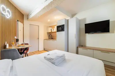 Un ou plusieurs lits dans un hébergement de l'établissement Studio charmant ile saint louis Paris 4 - 2P