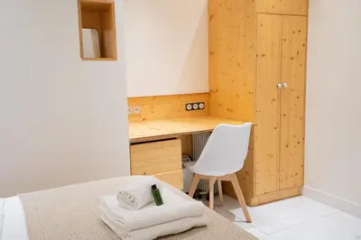 Un ou plusieurs lits dans un hébergement de l'établissement Charmant appartement centre Paris 2 - 2P