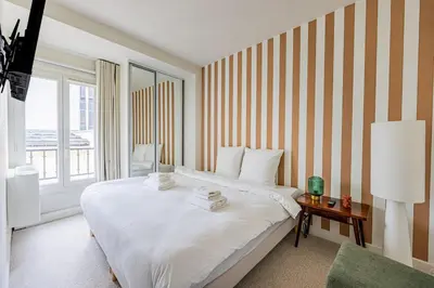 Un ou plusieurs lits dans un hébergement de l'établissement # 4people # 1Bedroom # ChampsElysées # AC
