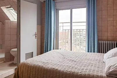 Un ou plusieurs lits dans un hébergement de l'établissement Hôtel de la Comète