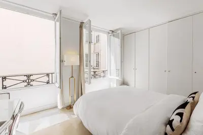 Un ou plusieurs lits dans un hébergement de l'établissement Apartment for 6 Saint-Honore
