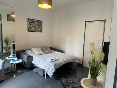 Un ou plusieurs lits dans un hébergement de l'établissement Cosy studio beaubourg, Paris centre