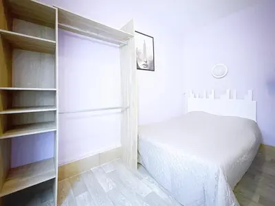 Un ou plusieurs lits dans un hébergement de l'établissement Au Fleuri hotel