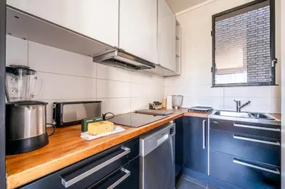 Cuisine ou kitchenette dans l'établissement Elegant Apartment Paris 16th - Near the Seine