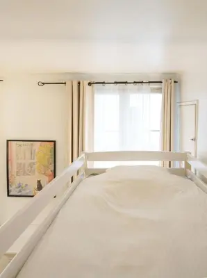 Un ou plusieurs lits dans un hébergement de l'établissement Studio au centre de Paris