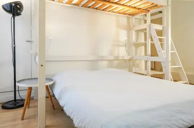 Un ou plusieurs lits dans un hébergement de l'établissement Studio au centre de Paris