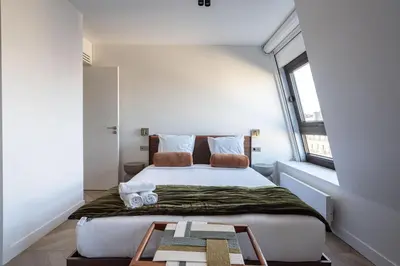 Un ou plusieurs lits dans un hébergement de l'établissement Sublime appartement Arc de Triomphe