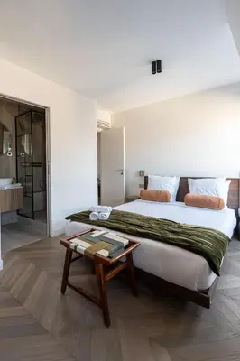 Un ou plusieurs lits dans un hébergement de l'établissement Sublime appartement Arc de Triomphe