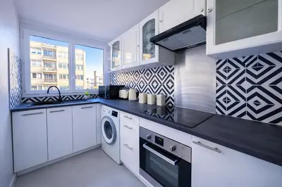 Cuisine ou kitchenette dans l'établissement Appartement charmant près du parc Montsouris