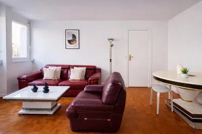 Coin salon dans l'établissement Appartement charmant près du parc Montsouris