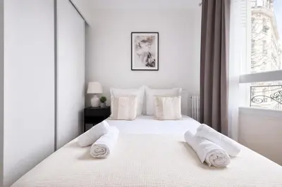 Un ou plusieurs lits dans un hébergement de l'établissement Splendide 3 pièces à Issy-les-Moulineaux