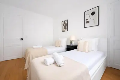 Un ou plusieurs lits dans un hébergement de l'établissement Splendide 3 pièces à Issy-les-Moulineaux
