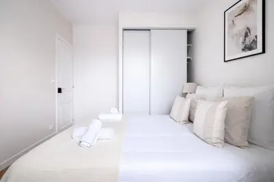 Un ou plusieurs lits dans un hébergement de l'établissement Splendide 3 pièces à Issy-les-Moulineaux