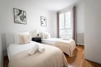 Un ou plusieurs lits dans un hébergement de l'établissement Splendide 3 pièces à Issy-les-Moulineaux