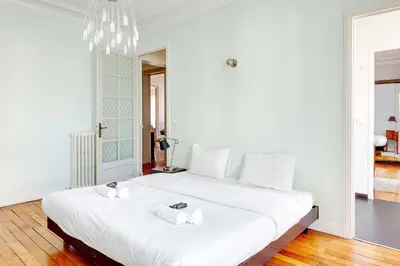 Un ou plusieurs lits dans un hébergement de l'établissement Appartement de charme au coeur de Montorgueil