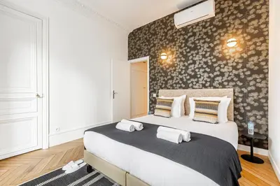 Un ou plusieurs lits dans un hébergement de l'établissement A1# 8people # 4Bedrooms # Wagram # AC # Paris 8