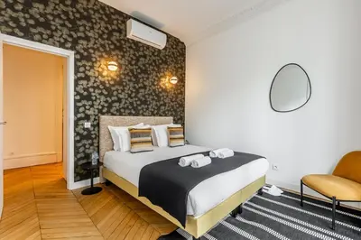 Un ou plusieurs lits dans un hébergement de l'établissement A1# 8people # 4Bedrooms # Wagram # AC # Paris 8