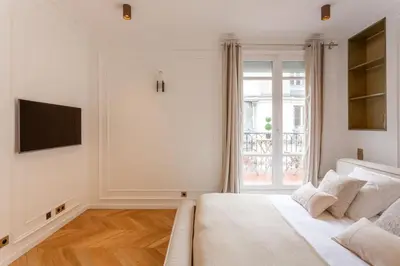 Un ou plusieurs lits dans un hébergement de l'établissement Elysee Prestige - Luxury Home near Champs Elysees