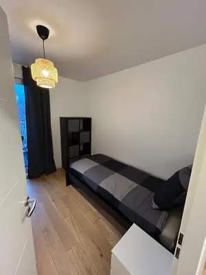 Un ou plusieurs lits dans un hébergement de l'établissement Appartement familial Proche Paris parking privée