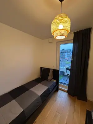 Un ou plusieurs lits dans un hébergement de l'établissement Appartement familial Proche Paris parking privée