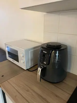 Cuisine ou kitchenette dans l'établissement Appartement familial Proche Paris parking privée