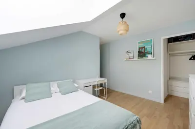 Un ou plusieurs lits dans un hébergement de l'établissement 3bdr-4P family flat on the outskirts of Paris
